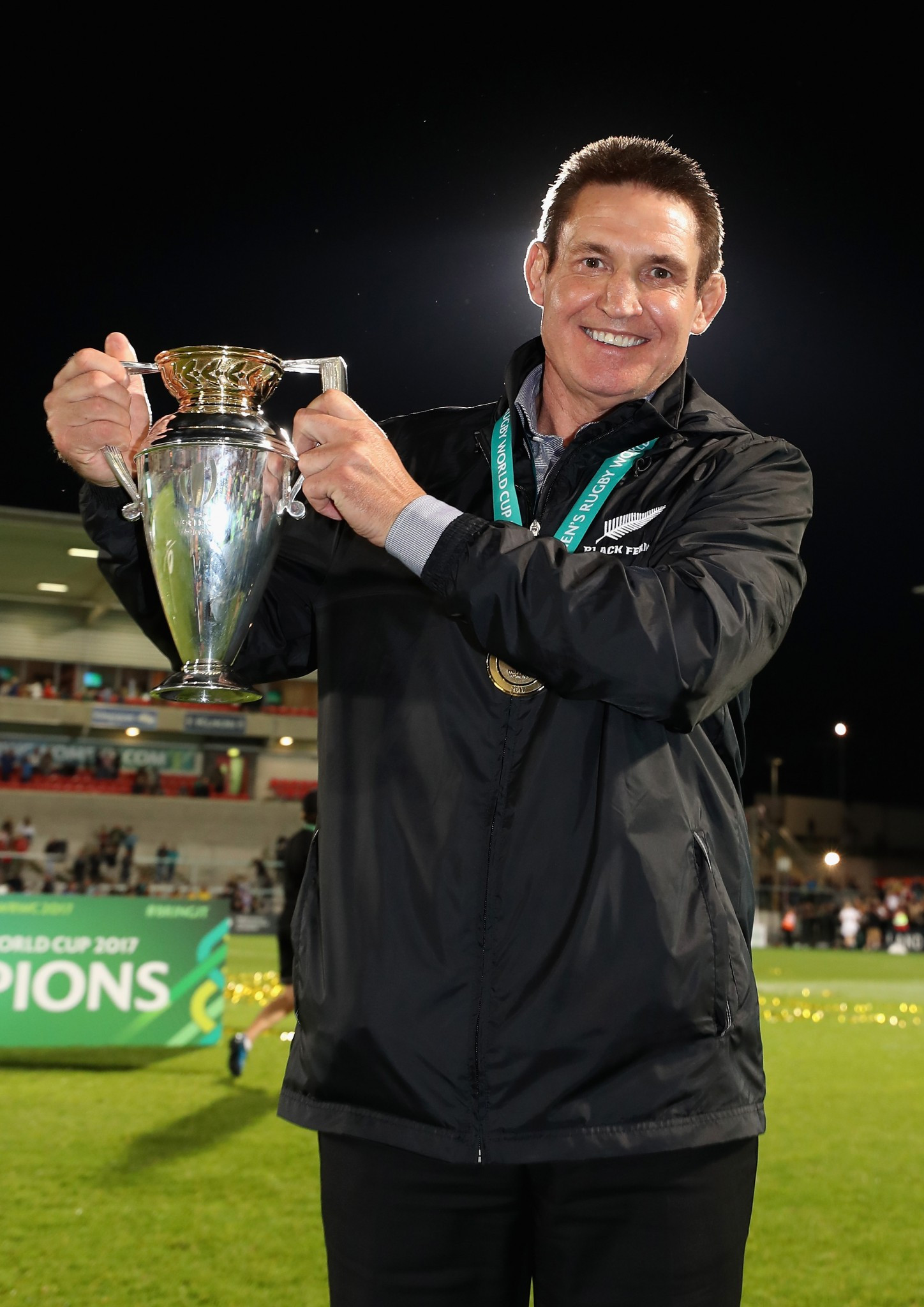 Mixed message? Glenn Moore, head coach of New Zealand's Black Ferns, displays the Women's Rugby World Cup they regained against England in Belfast after recovering from 17-10 down at half-time ©Getty Images