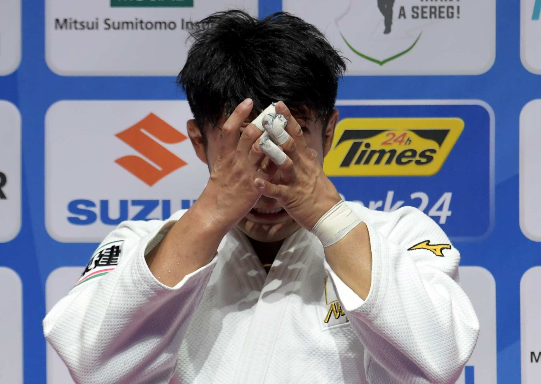 The Japanese star was visibly emotional when he was given his gold medal ©Getty Images