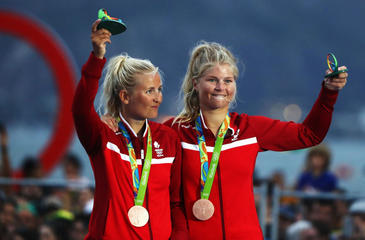 Denmark's Jena Hansen and Katia Salskov-Iversen, pictured celebrating bronze at the Rio 2016 Games, have put themselves in a strong position to win the World 49erFX Championships in Porto with one day's sailing remaining ©Getty Images