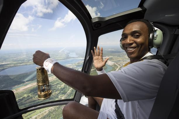 CBC News Toronto co-host Dwight Drummond carried the flame on board a helicopter ahead of one of two Lighting Ceremonies which got the Parapan American Games Torch Relay underway 