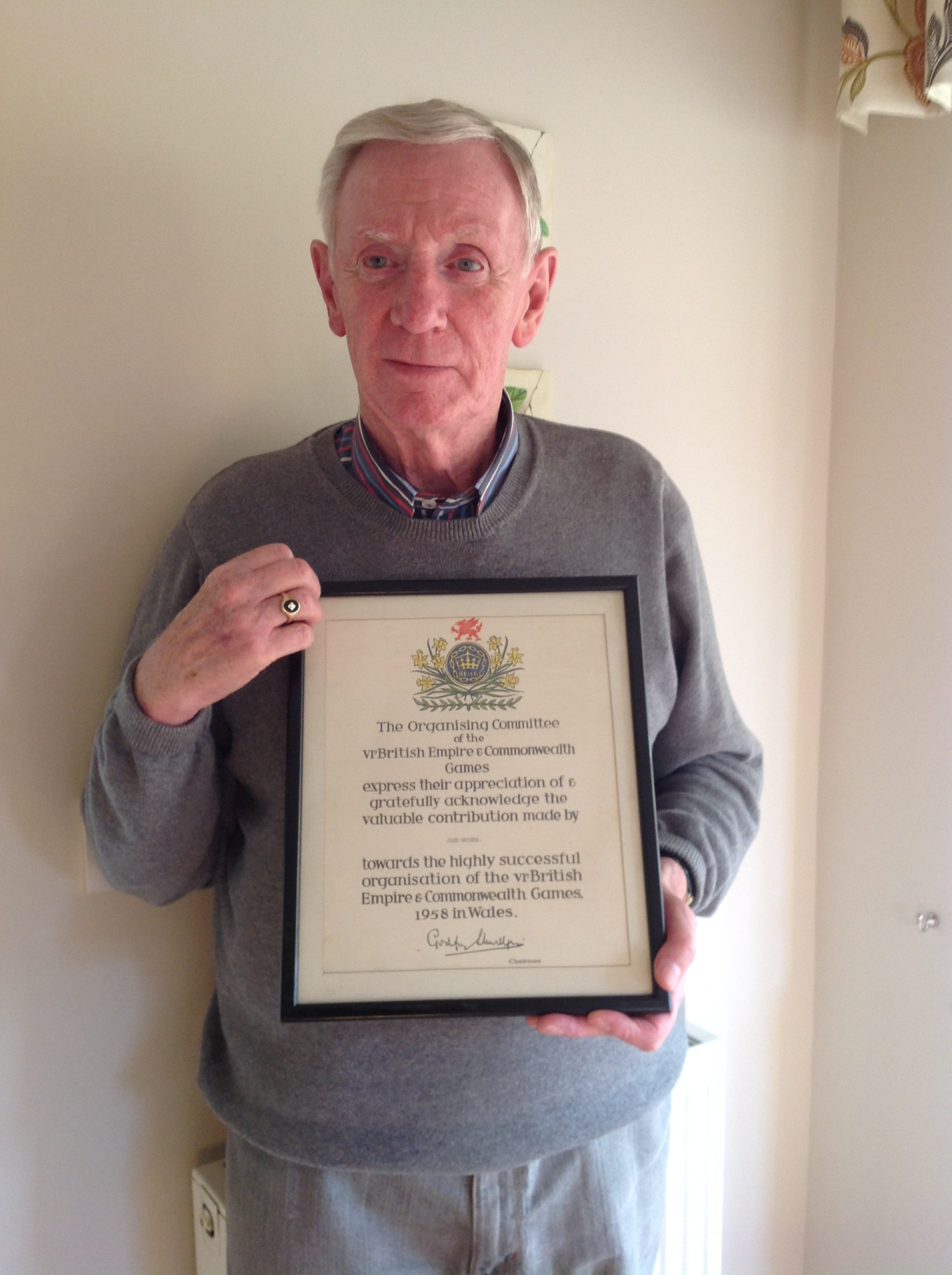 John Rogers displays a certificate recalling his involvement in the 1958 Baton Relay ©Graham Greasley