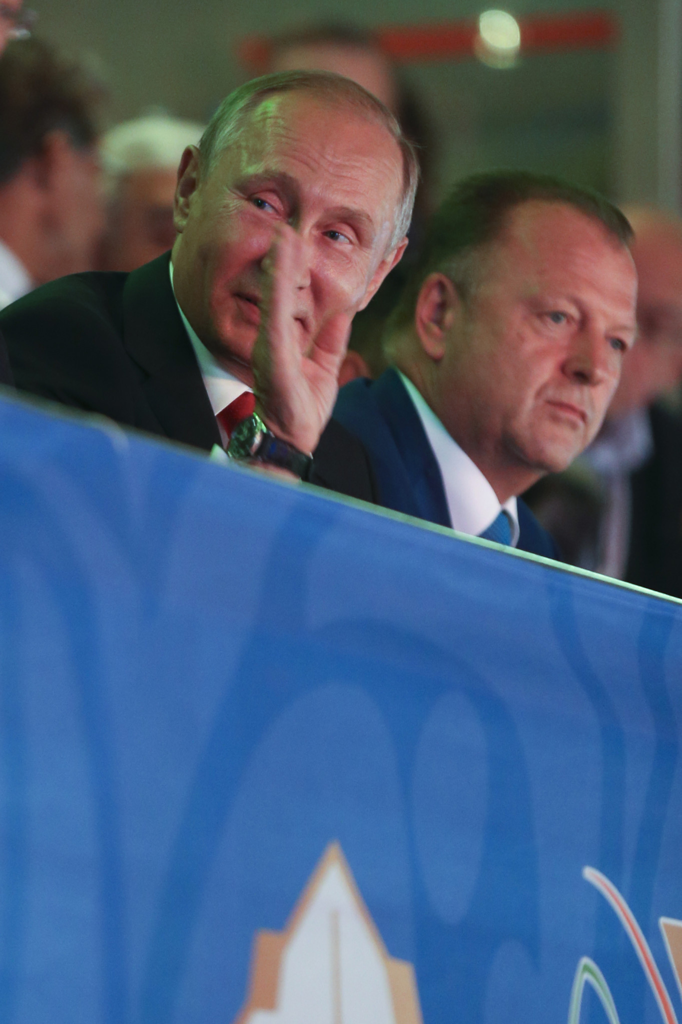 Russian President Vladimir Putin, left, waves next to Marius Vizer, head of the International Judo Federation, right, during the World Championships in Budapest ©Getty Images