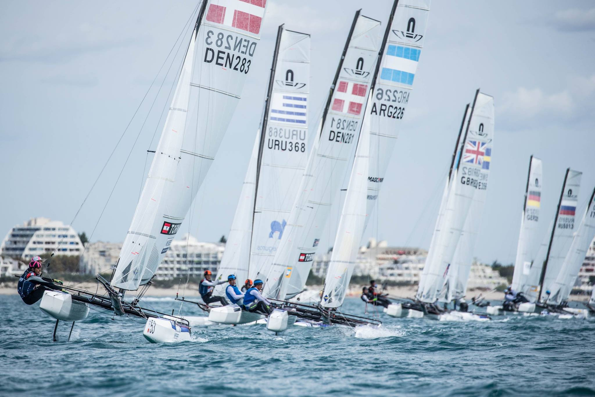 Denmark's Lin Ea Cenholt Christiansen and Christian Peter Lübeckafter, left, maintained their lead at the top of the Nacra 17 World Championships standings ©Facebook
