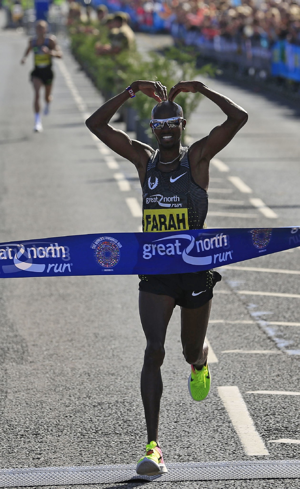 Britain's Sir Mo Farah winning a third consecutive Great North Run title last year - but Ethiopia's Olympic marathon silver medallist Feyisa Lilesa will test his ambitions of winning a fourth title tomorrow ©Getty Images