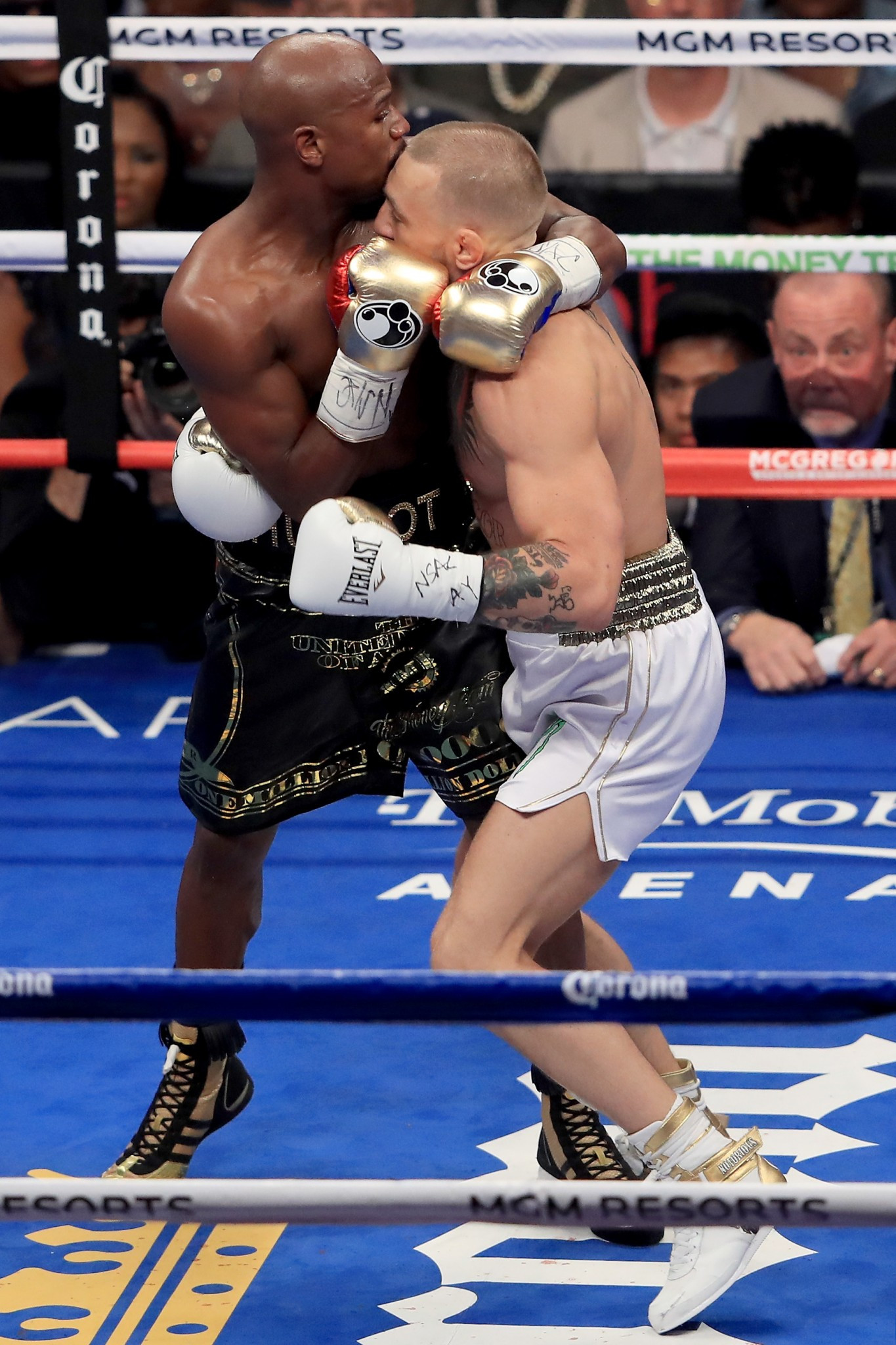 Floyd Mayweather Jr throws a punch at Conor McGregor during their boxing match ©Getty Images