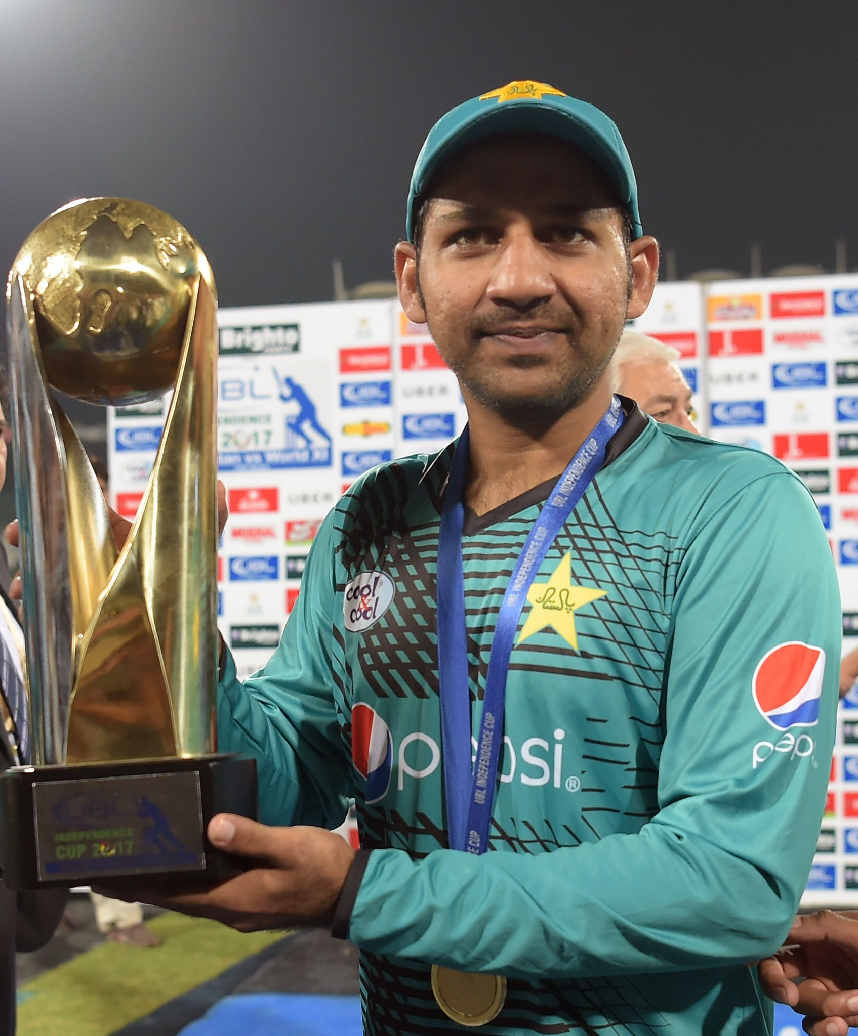 Pakistani cricket captain Sarfraz Ahmad holds the trophy after winning the third and final Twenty20 International match against World XI at the Gaddafi Cricket Stadium ©Getty Images