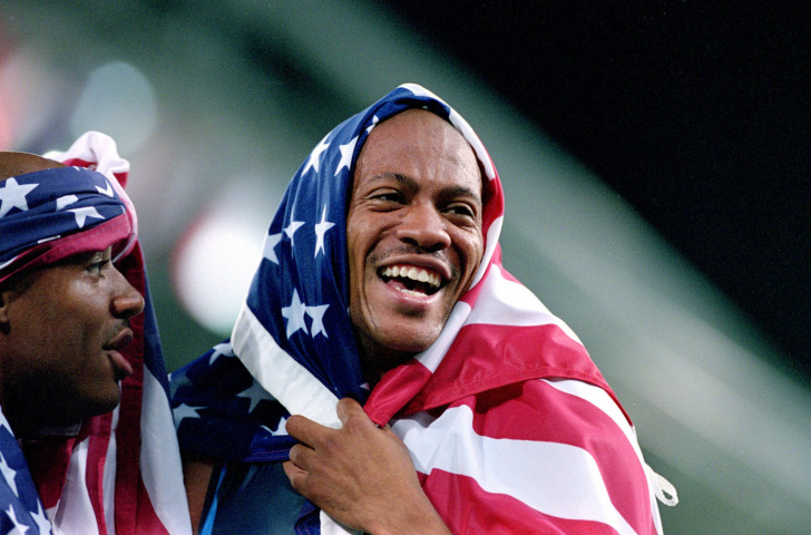 Maurice Greene celebrates winning the 4x100m gold at the 2000 Sydney Olympics. But now he has a logical problem with his greatest of all time tattoo ©Getty Images