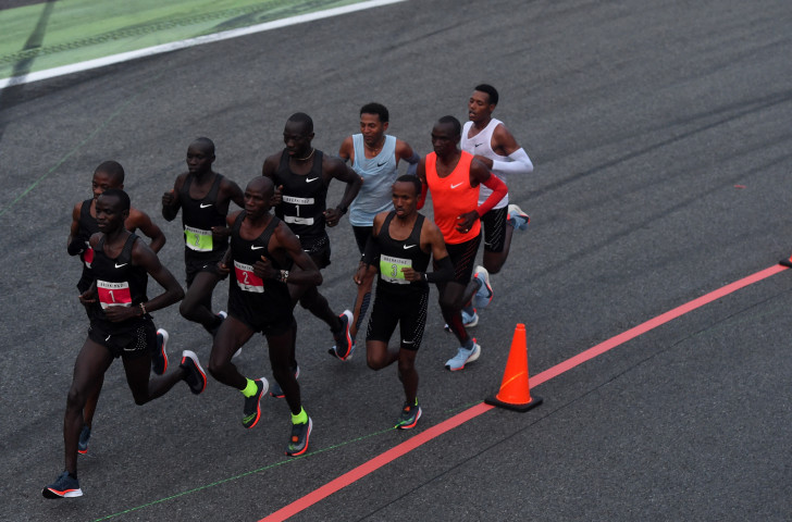 Eliud Kipchoge, in orange, with his two team-mates, making an unsuccessful attempt to break two hours for the marathon at the Monza F1 track earlier this year. He's great too. But the greatest of all time? ©Getty Images