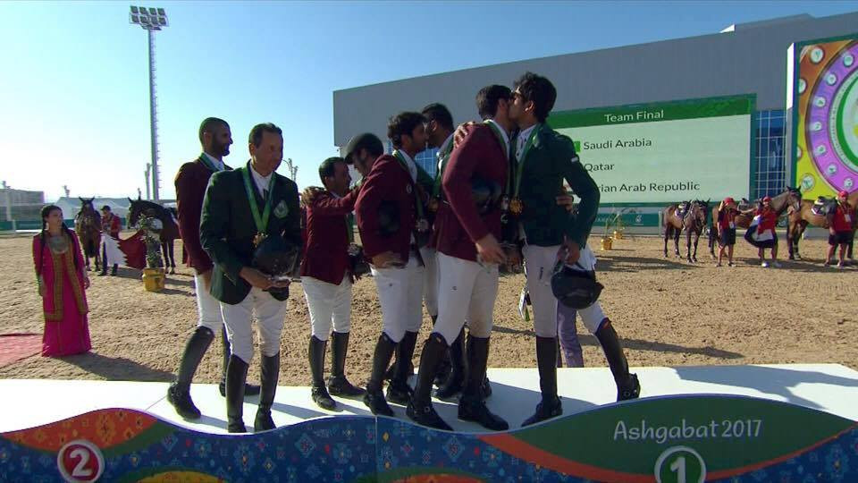 Jumpers from Saudi Arabia and Qatar embrace on top of the medals podium ©OCA