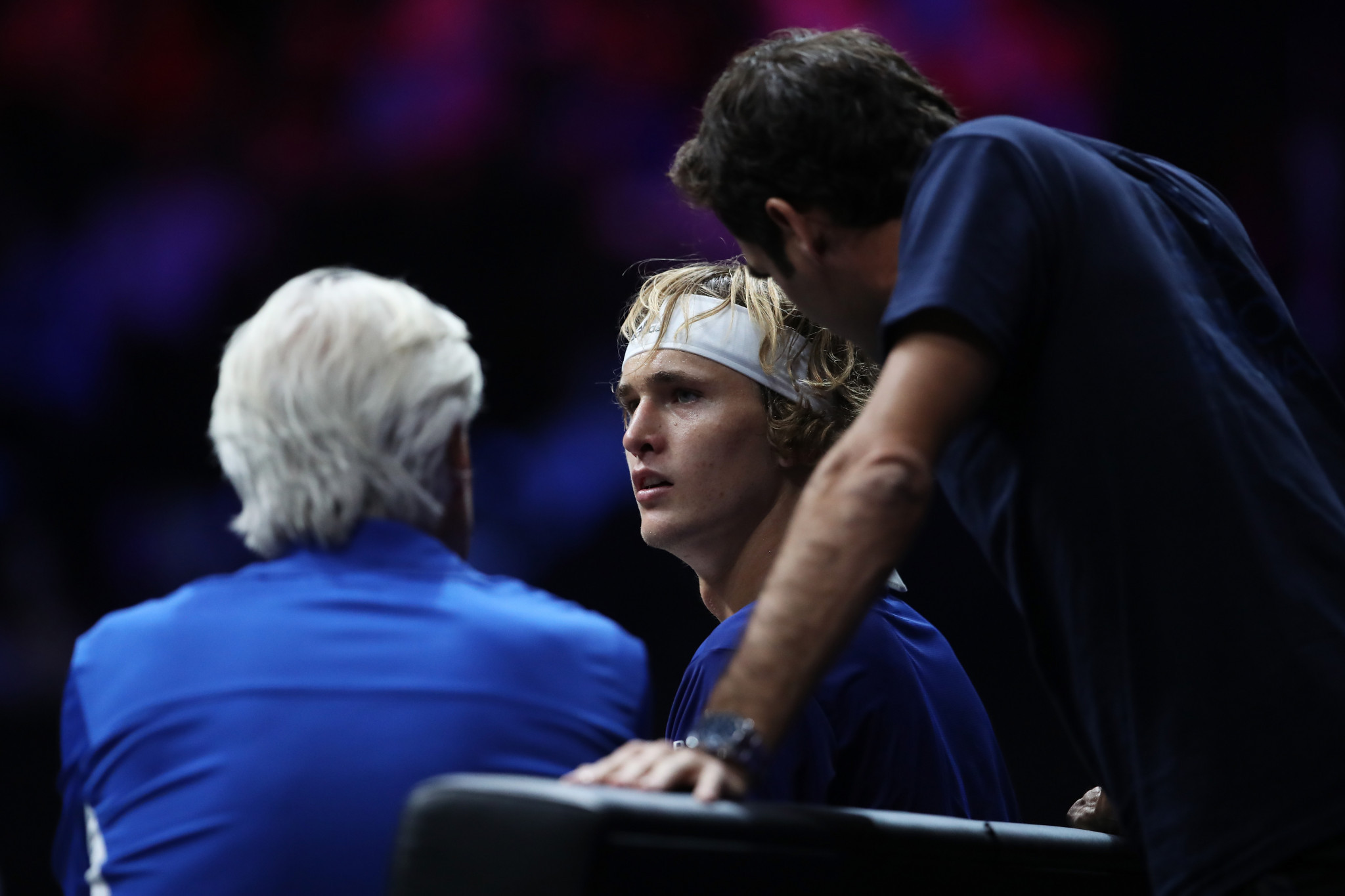 Team Europe's Alexander Zverev gets input from non-playing captain Bjorn Borg, left, and team-mate Roger Federer during his victory over the World team's Denis Shapovalov on the opening day of the inaugural Laver Cup in Prague ©Getty Images