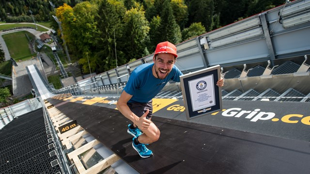 Rydzek enters record books after running up ski jump hill