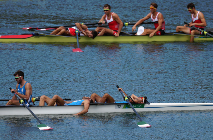 Italy, who finished outside the medals, and winners Switzerland in the aftermath of the lightweight men's four final at the Rio 2016 Games ©Getty Images
