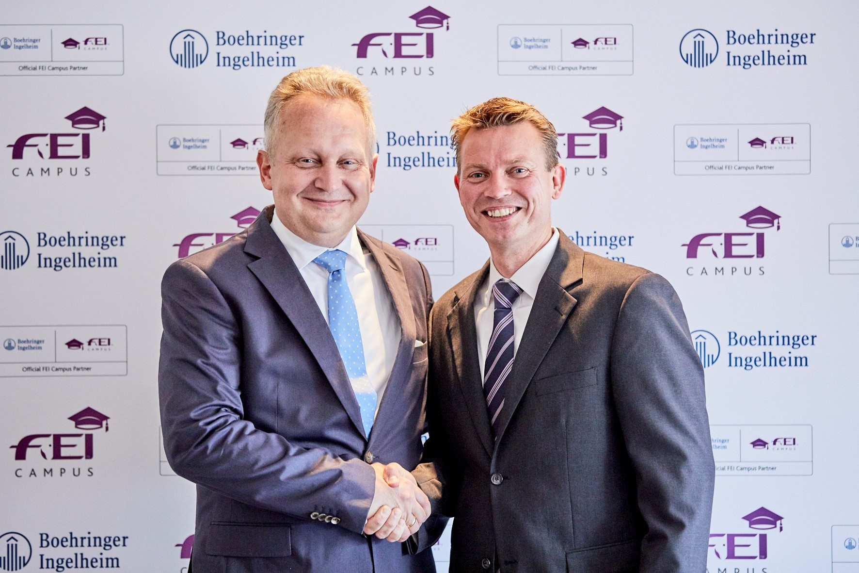 Dr Erich Schött, left, head of strategic business unit equine at Boehringer Ingelheim, with Ralph Straus, commercial director of the International Equestrian Federation, after agreeing the new partnership ©FEI