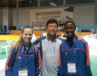 Jung Hyun Cho, national coach master with the South Africa Taekwondo Federation, is pictured in Jeonju, South Korea, with two of his students, Neo Botha, left, and Cavin Mosimanegape Seitlhamo  ©South Africa Taekwondo Federation/Facebook