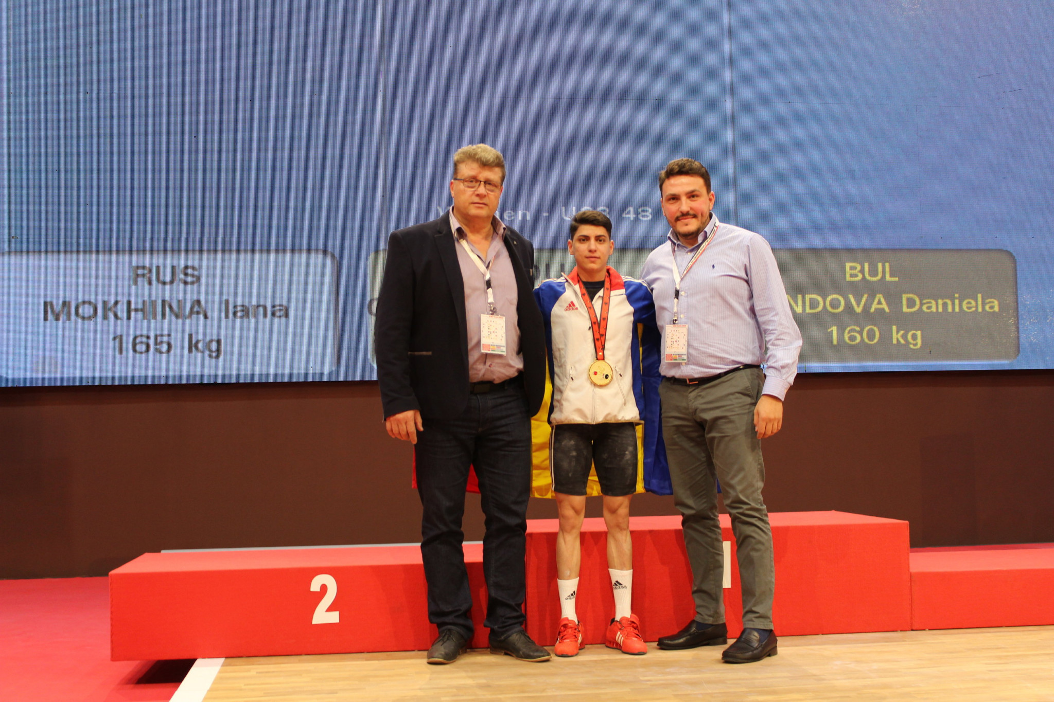 Nicu Vlad, a Romanian weightlifting legend, left, with today's gold medallist Monica Csengeri and Alex Padure, secretary general of the Romanian Weightlifting Federation, right ©RWF