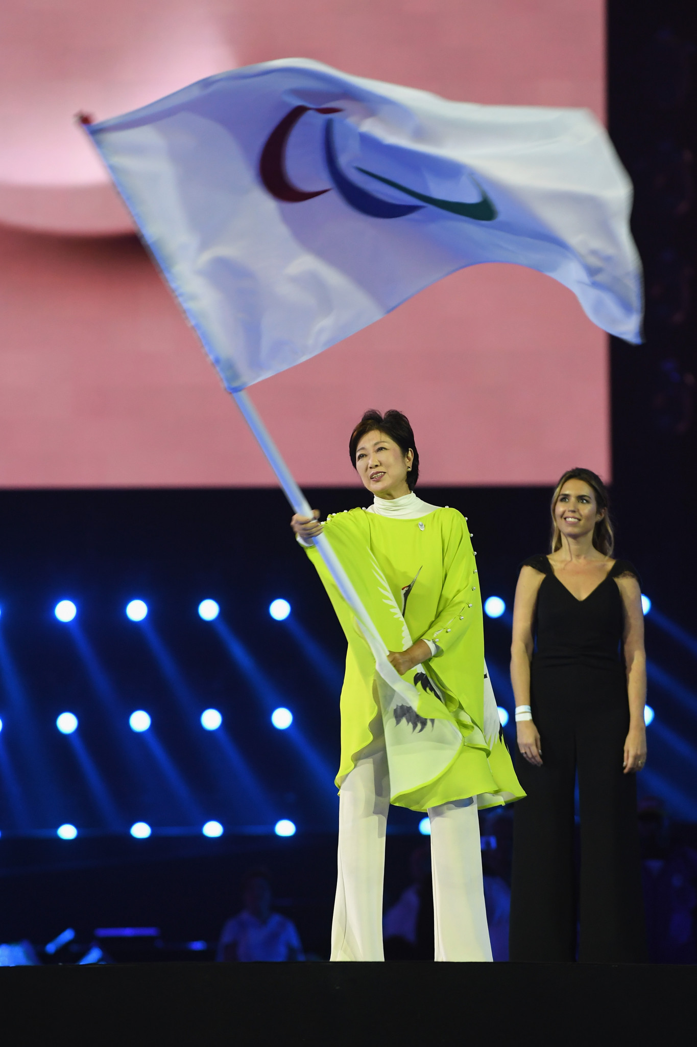 Tokyo’s Governor Yuriko Koike waves the IPC flag during the Closing Ceremony of the Rio 2016 Paralympic Games ©Getty Images