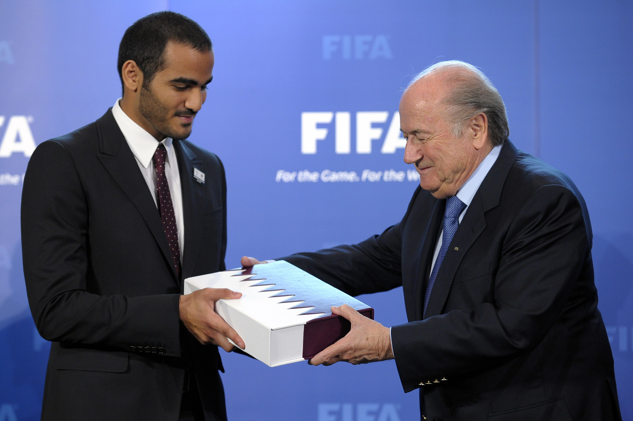 Chairman of Qatar 2022 bid committee Sheik Mohammed bin Hamad Al Thani delivers the bid book to FIFA President Sepp Blatter during an official handover ceremony at FIFA's headquarters in May 2010 in Zurich ©Getty Images 