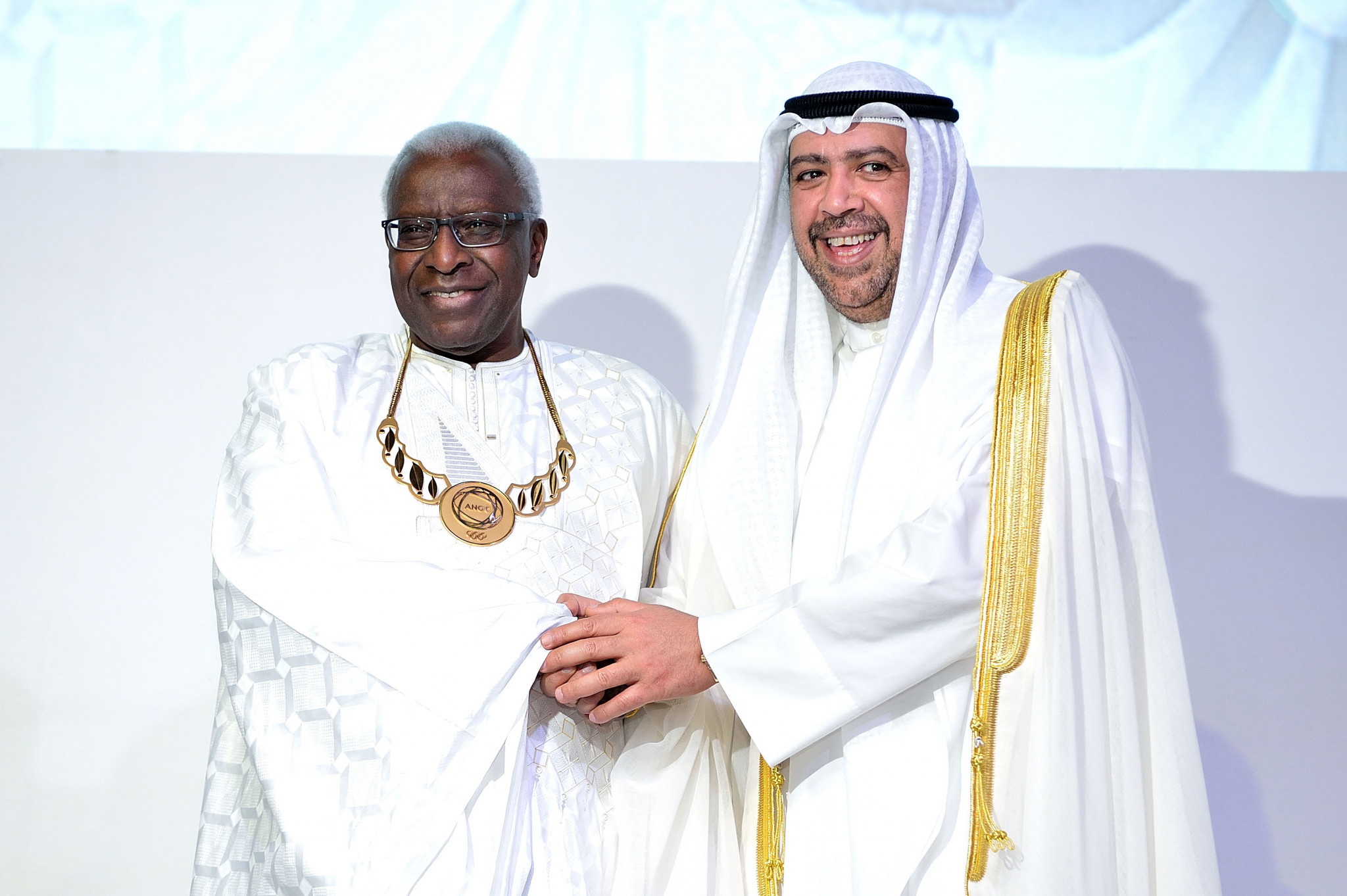 Lamine Diack, left, pictured with Sheikh Ahmad at the 2014 ANOC General Assembly in Bangkok ©Getty Images