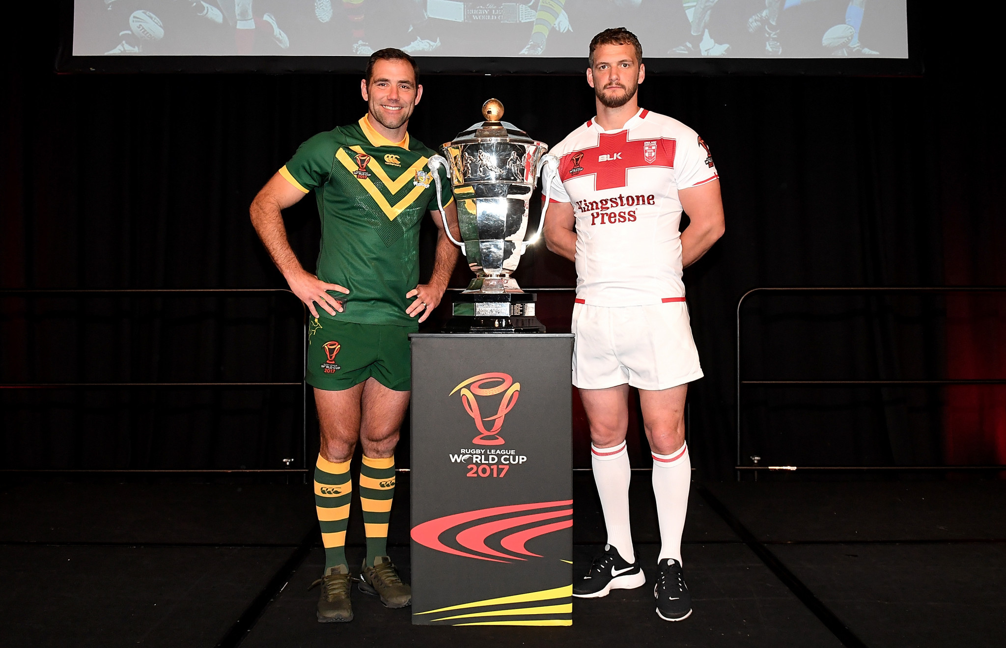 Australia captain Cameron Smith, left, and England counterpart Sean O'Loughlin, right, pose with the Rugby League World Cup trophy at the official launch in Brisbane today ©Getty Images