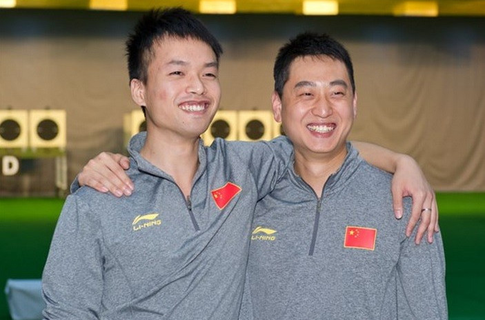 China secured a one-two in the men's rapid fire pistol event as Hu Haozhe (right) edged teammate Lao Jiajie 
