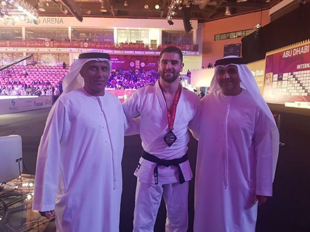 United Arab Emirates officials congratulated Israel’s Peter Paltchik after winning bronze today ©IJF