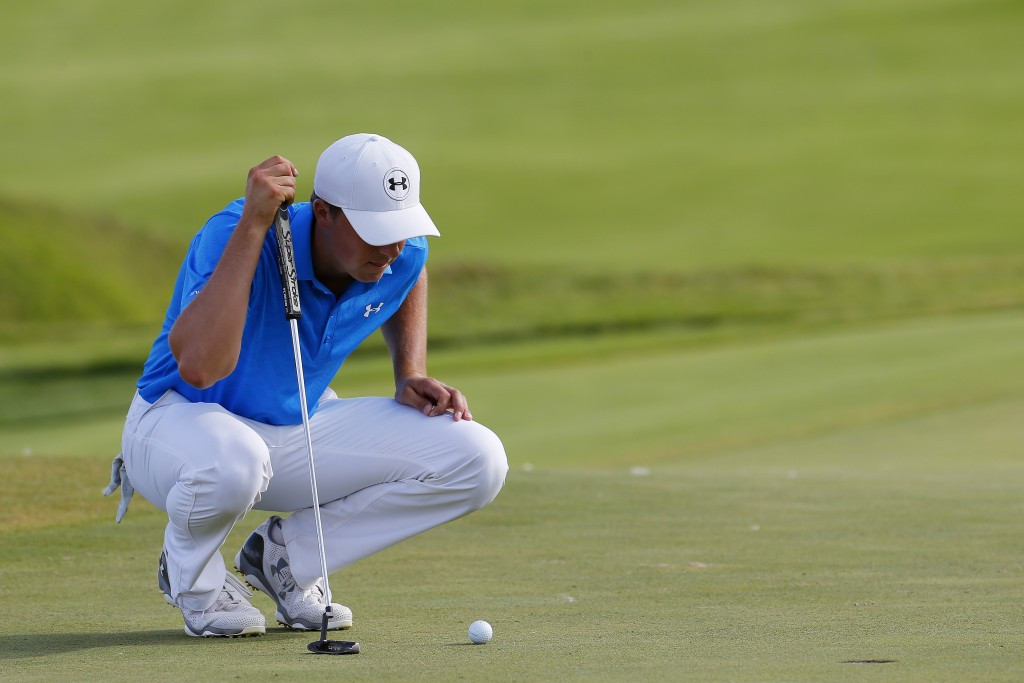 Jordan Spieth began his pursuit of a third major of the year with a one-under-par round