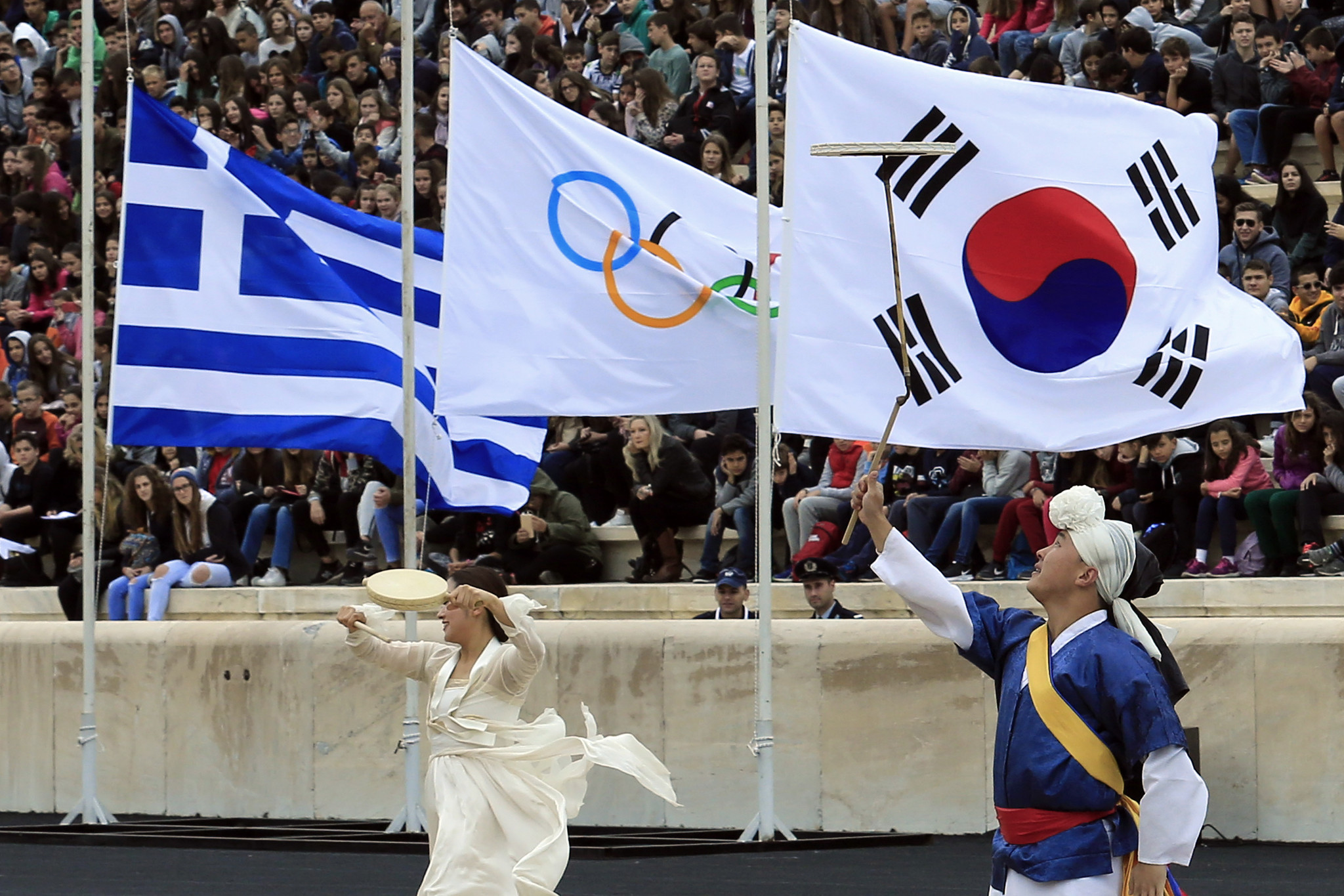 The Greek and South Korean flags fly next to the Olympic Rings ©Getty Images