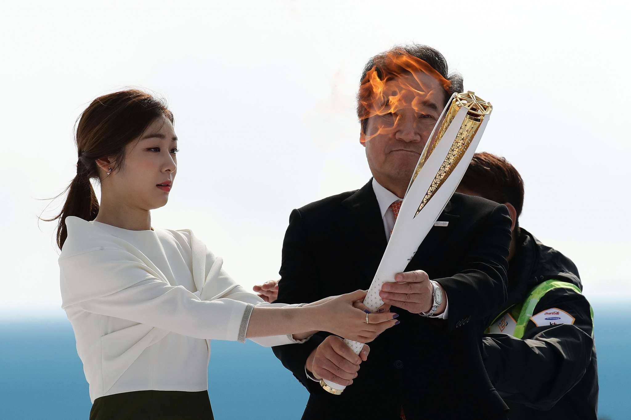 South Korean Prime Minister Lee Nak-yon and 2010 Vancouver Olympic figure skating champion Kim Yu-Na hold the Pyeongchang 2018 Winter Olympics Torch at Incheon International Airport ©Getty Images