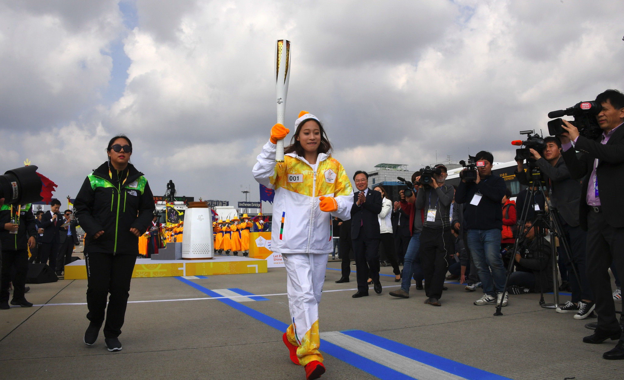 You Young carried the Torch the first 200 metres across the bridge ©Getty Images