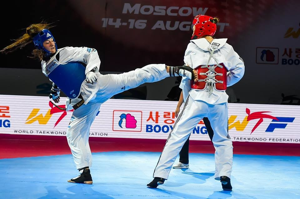 Nadia Kus (left) delivers a successful kick en route to women's heavyweight gold over Donghua Li  of China ©WTF