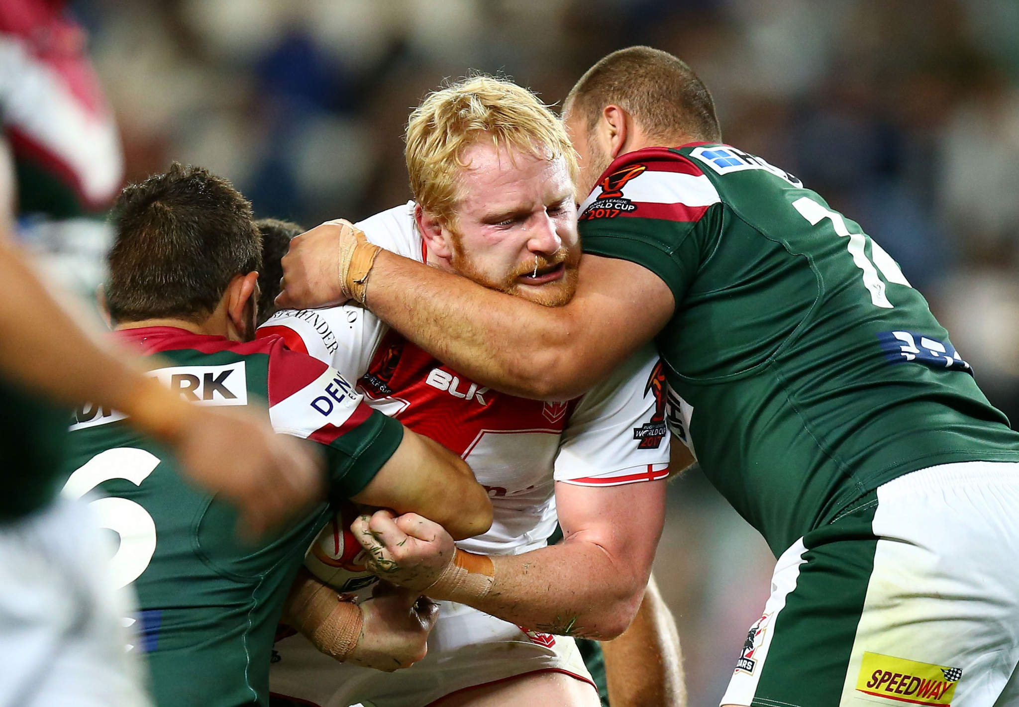  James Graham of England is tackled by Lebanon's Mitchell Moses, left, and Mitchell Mamary at the Allianz Stadium in Sydney, Australia ©Getty Images