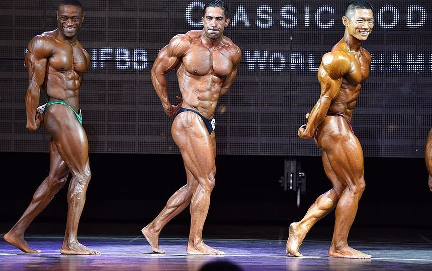 Ryu, right, capped off a successful day by claiming the classic overall crown ©Igor Kopcek/East Labs Team/IFBB