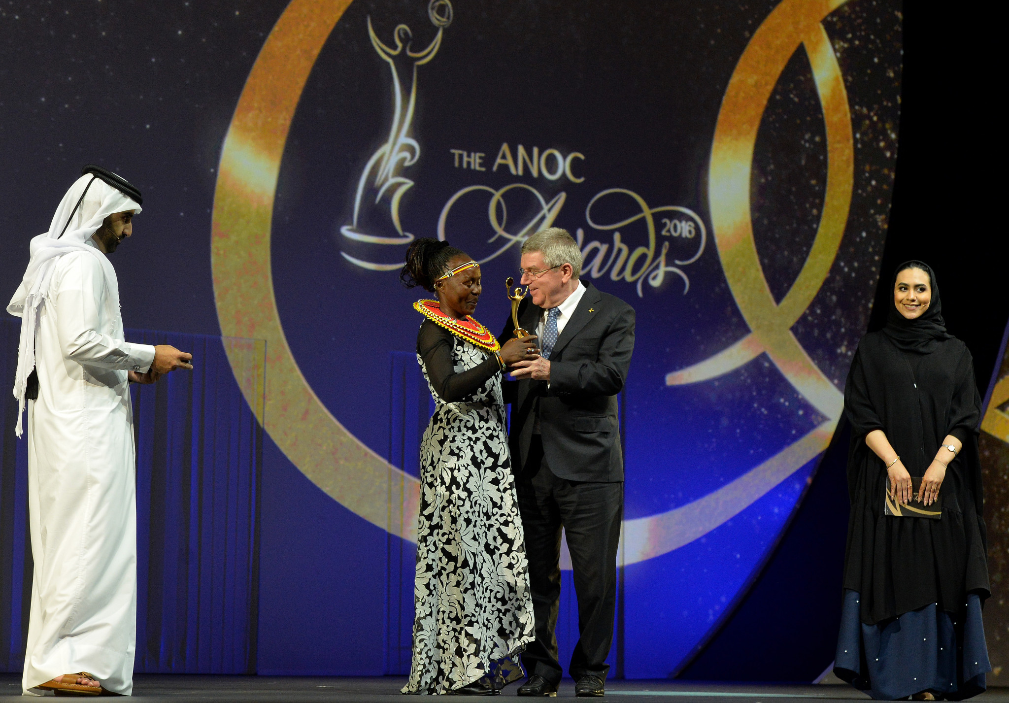 Tegla Loroupe, left, pictured with IOC President Thomas Bach during the 2016 ANOC Gala Awards in Doha ©Getty Images
