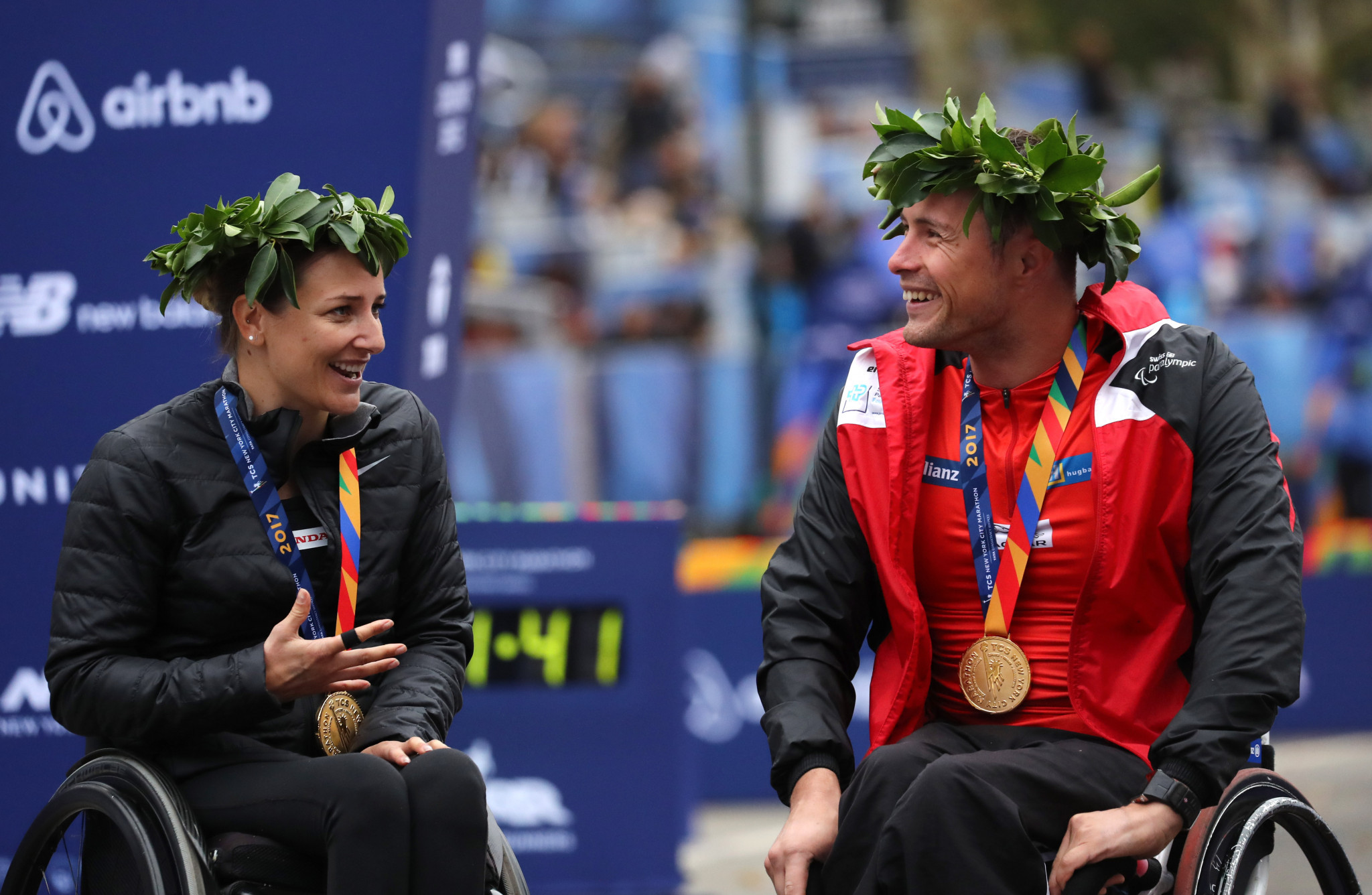 Manuela Schar of Switzerland, left, and Marcel Hug, also of Switzerland, celebrate winning the Professional Wheelchair Divisions during the 2017 New York City Marathon in the United States ©Getty Images