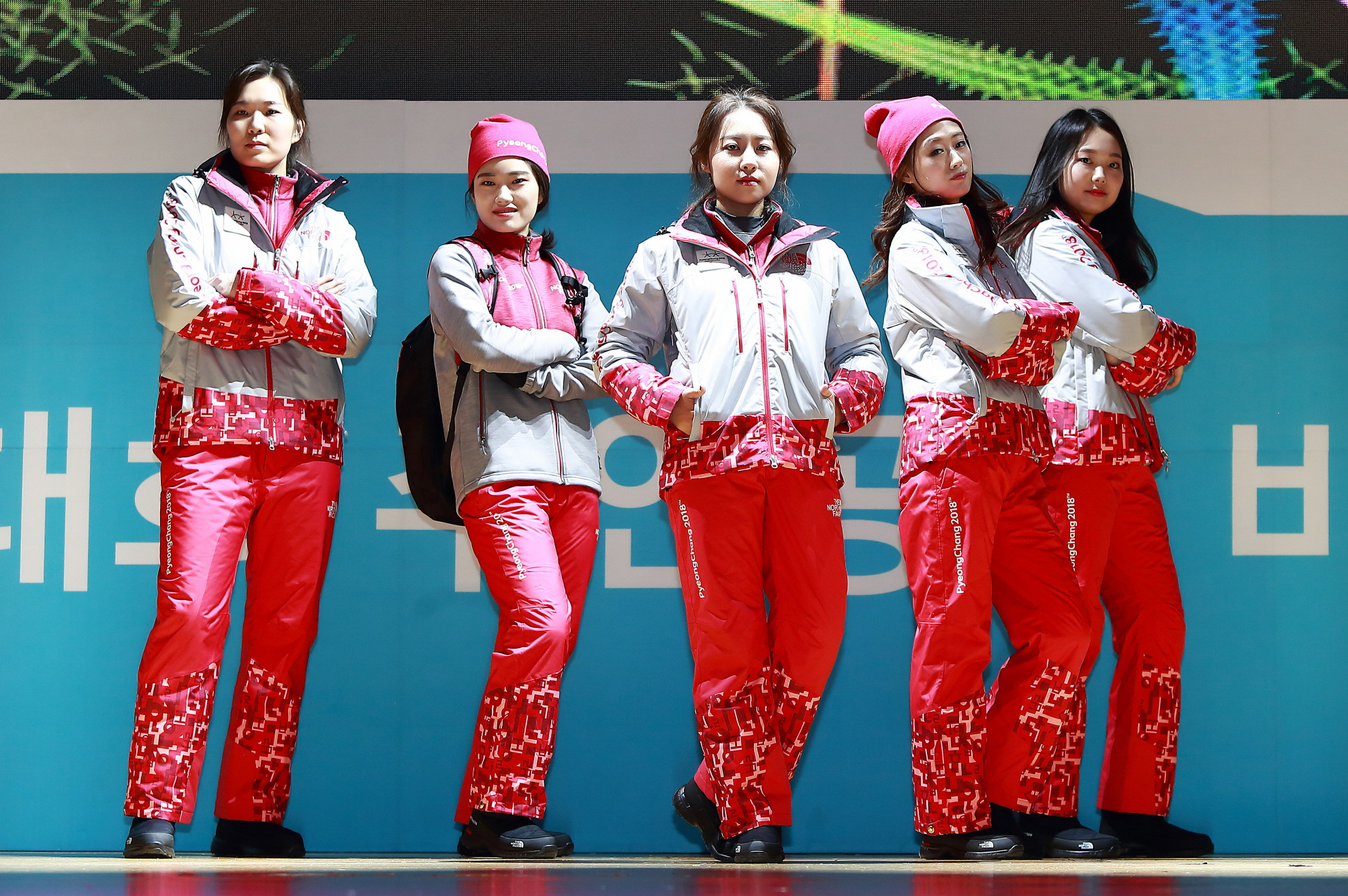 The Passion Crew show off their festive uniforms after the unveiling in Seoul of a festive red outfit that also represents the national flag ©Pyeongchang2018