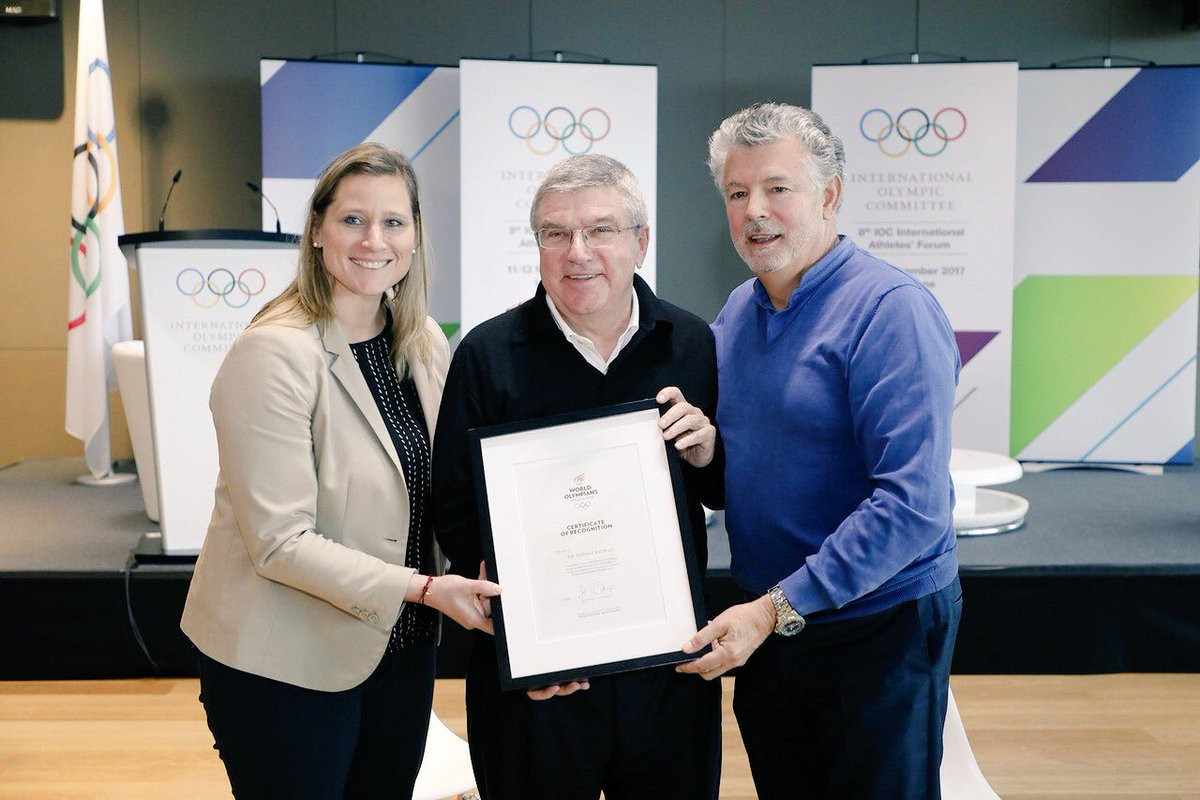 Angela Ruggiero, left, Thomas Bach, centre, and Joël Bouzou, right, are pictured at the International Athletes' Forum ©WOA