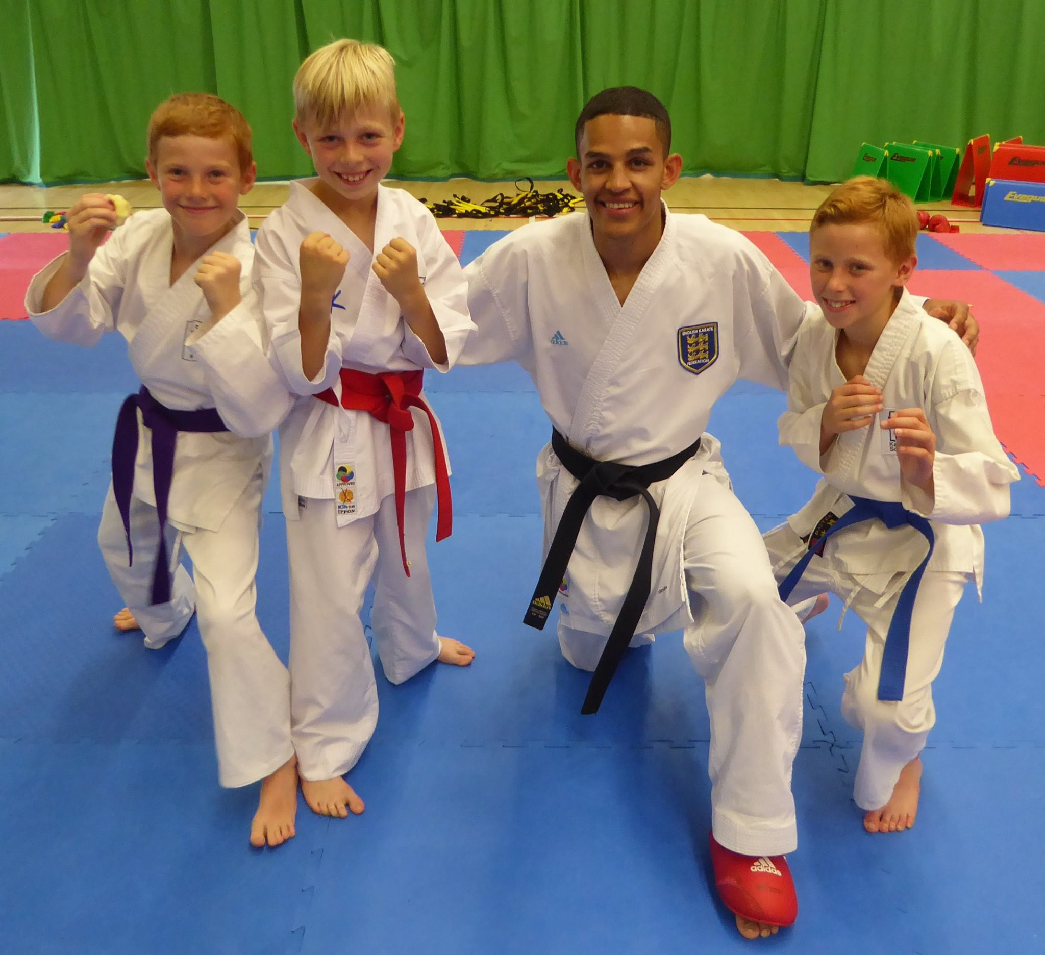 British karate world champion Jordan Thomas is pictured with young students of the game ©Jordan Thomas/Facebook
