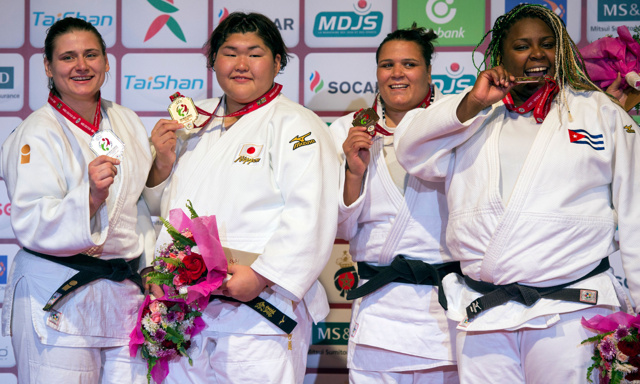 Bosnia's silver medallist Larisa Ceric, Japan's gold medallist Sarah Asahina, Tunisia's bronze medallist Nihel Cheikh Rouhou and Cuba's bronze medallist Idalys Ortiz pose on the podium with their medals following their women's Judo World Championships Open in Marrakesh ©Getty Images
