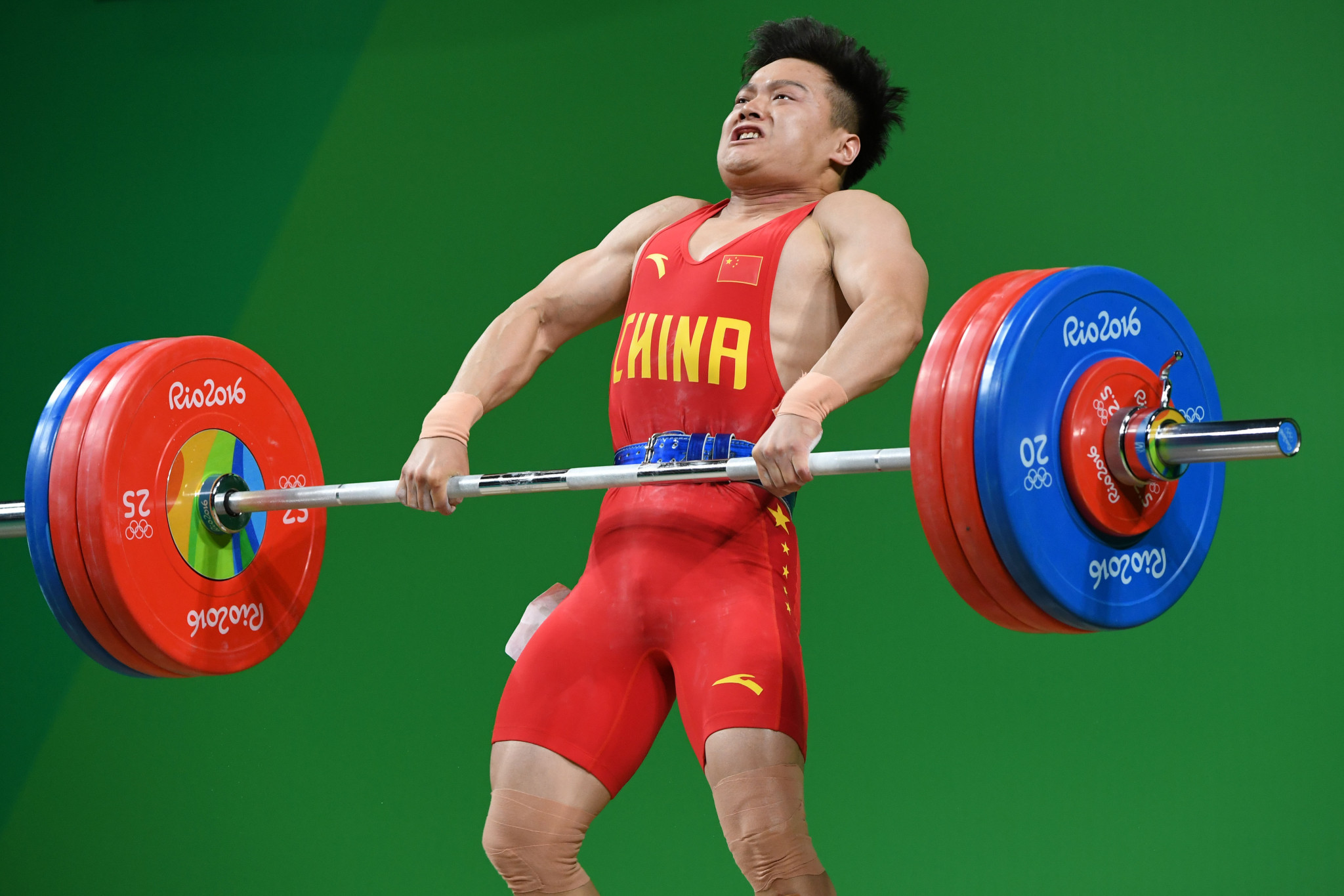 China's Long Qingquan competes during the men's 56kg weightlifting event at the Rio 2016 Olympic Games in Rio de Janeiro ©Getty Images