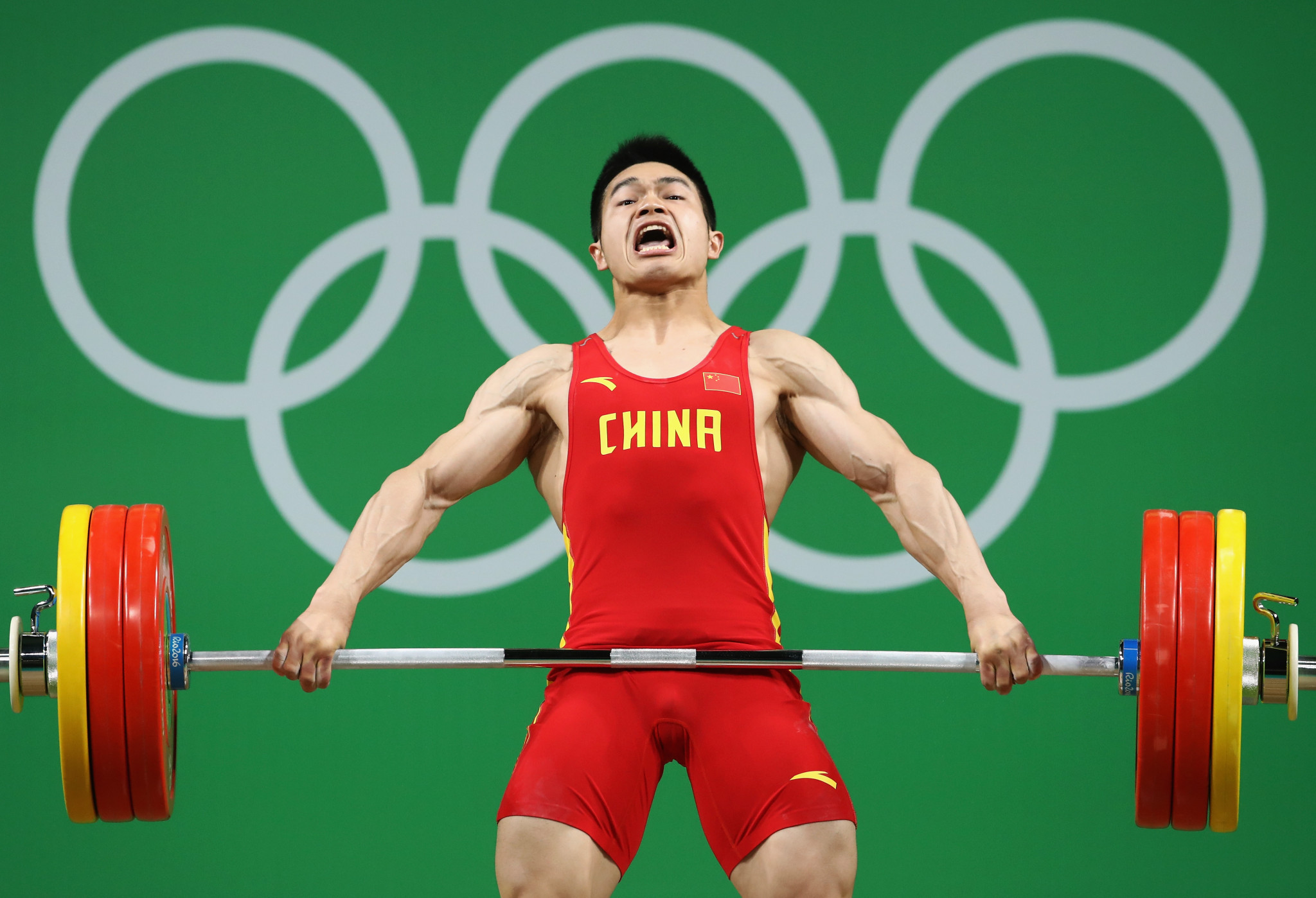 Zhiyong Shi, of China, competes during the men's 69kg Group A weightlifting contest at the Rio 2016 Olympic Games ©Getty Images