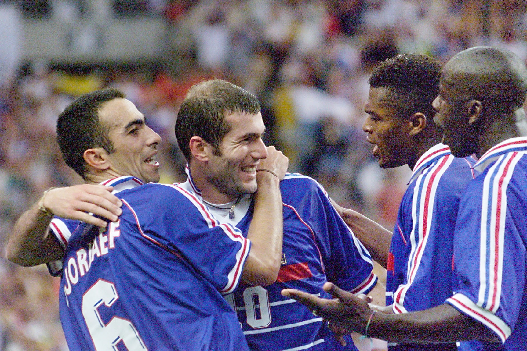 France enjoyed the benefits of an exceptionally diverse squad as they lifted the World Cup in 1998. Zinedine Zidane, second left, is seen here being hugged by teammates Youri Djorkaeff, left, Marcel Desailly and Lilian Thuram, right, in the final against Brazil ©Getty Images