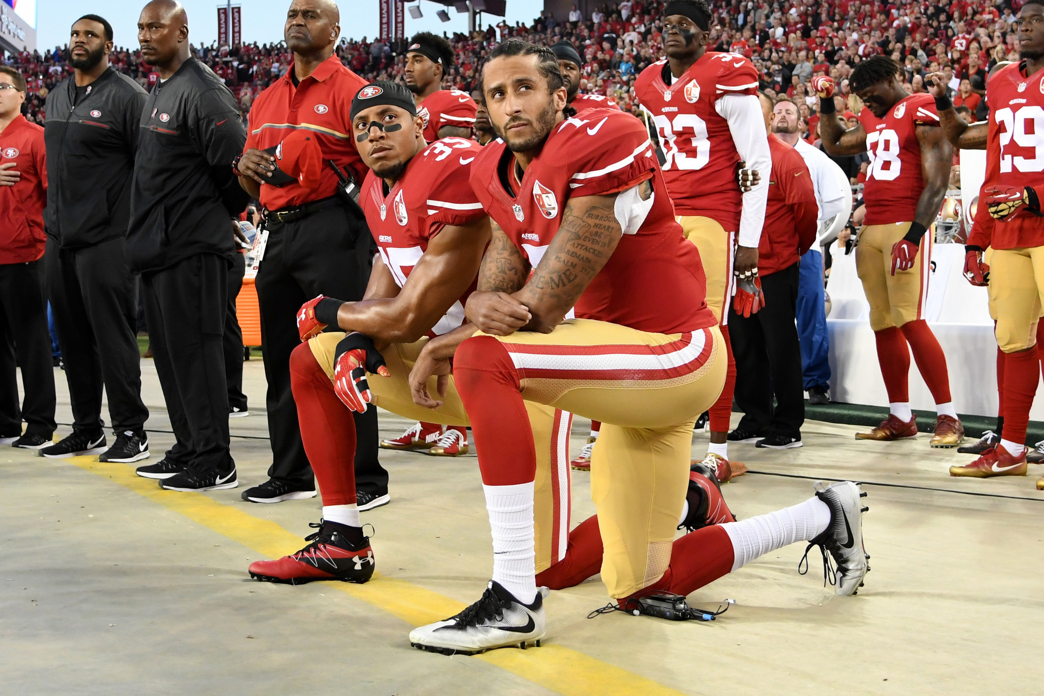 Colin Kaepernick and team-mate Eric Reid of the San Francisco 49ers kneel in protest during the national anthem prior to playing the Los Angeles Rams in September 2016. Kaepernick has been named GQ magazine's Citizen of the Year ©Getty Images
