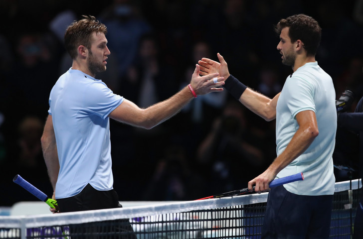 Grigor Dimitrov, right, shakes hands with Jack Sock after earning a three-sets victory in the second semi-final at the ATP World Tour Finals in London ©Getty Images
