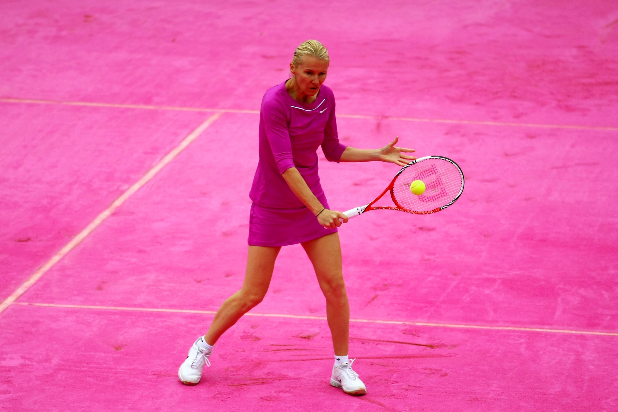 Jana Novotna, pictured here in the women's legends doubles at the French Open at Roland Garros in 2012, has died at the age of 49 ©Getty Images