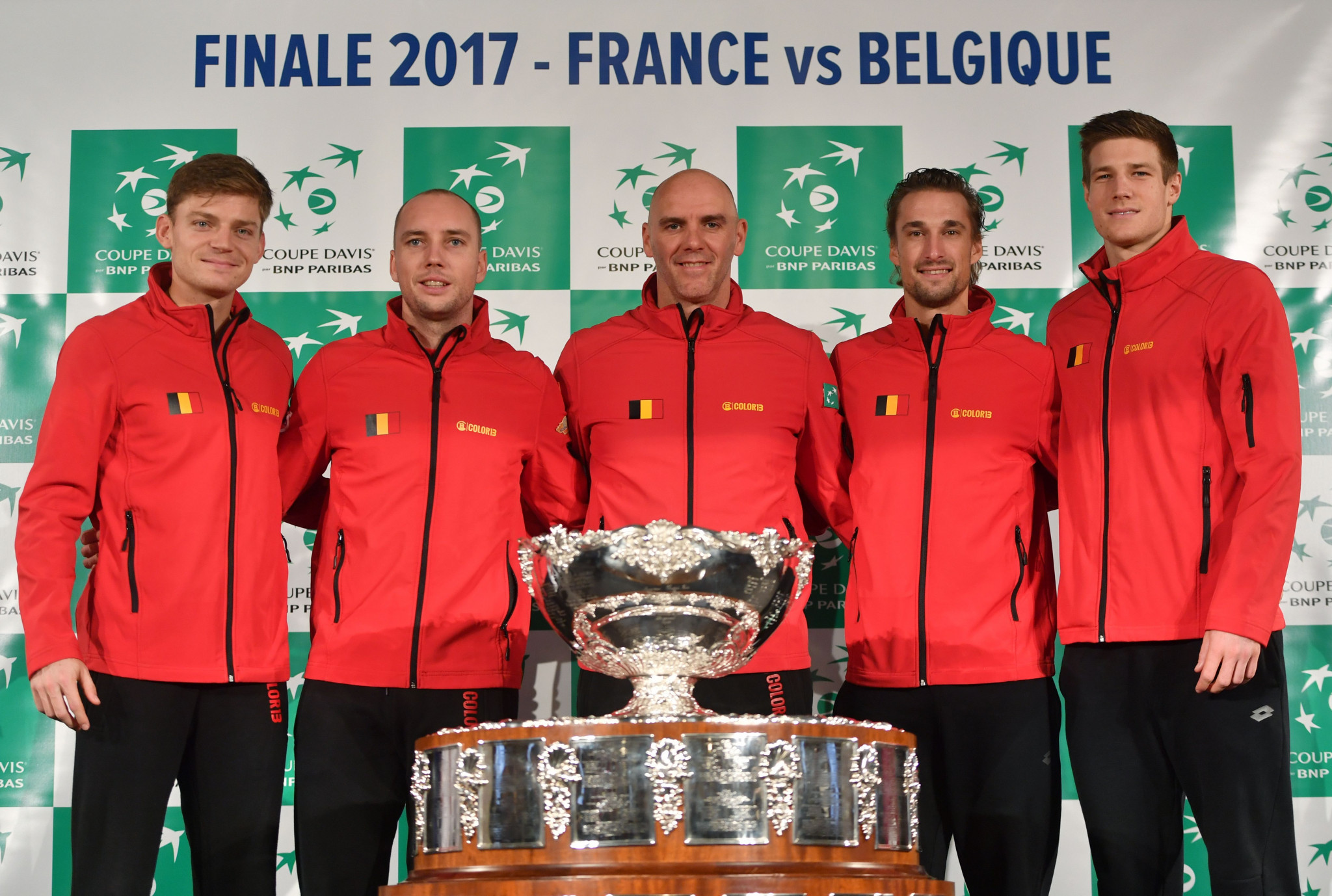 Belgium's captain Johan Van Herck (C) poses with his players (LtoR) David Goffin, Steve Darcis, Ruben Bemelmans and Arthur de Greef with the trophy during the team presentation in Villeneuve-d'Ascq on November 23, 2017, ahead of the Davis Cup World Group final between France and Belgium ©Getty Images