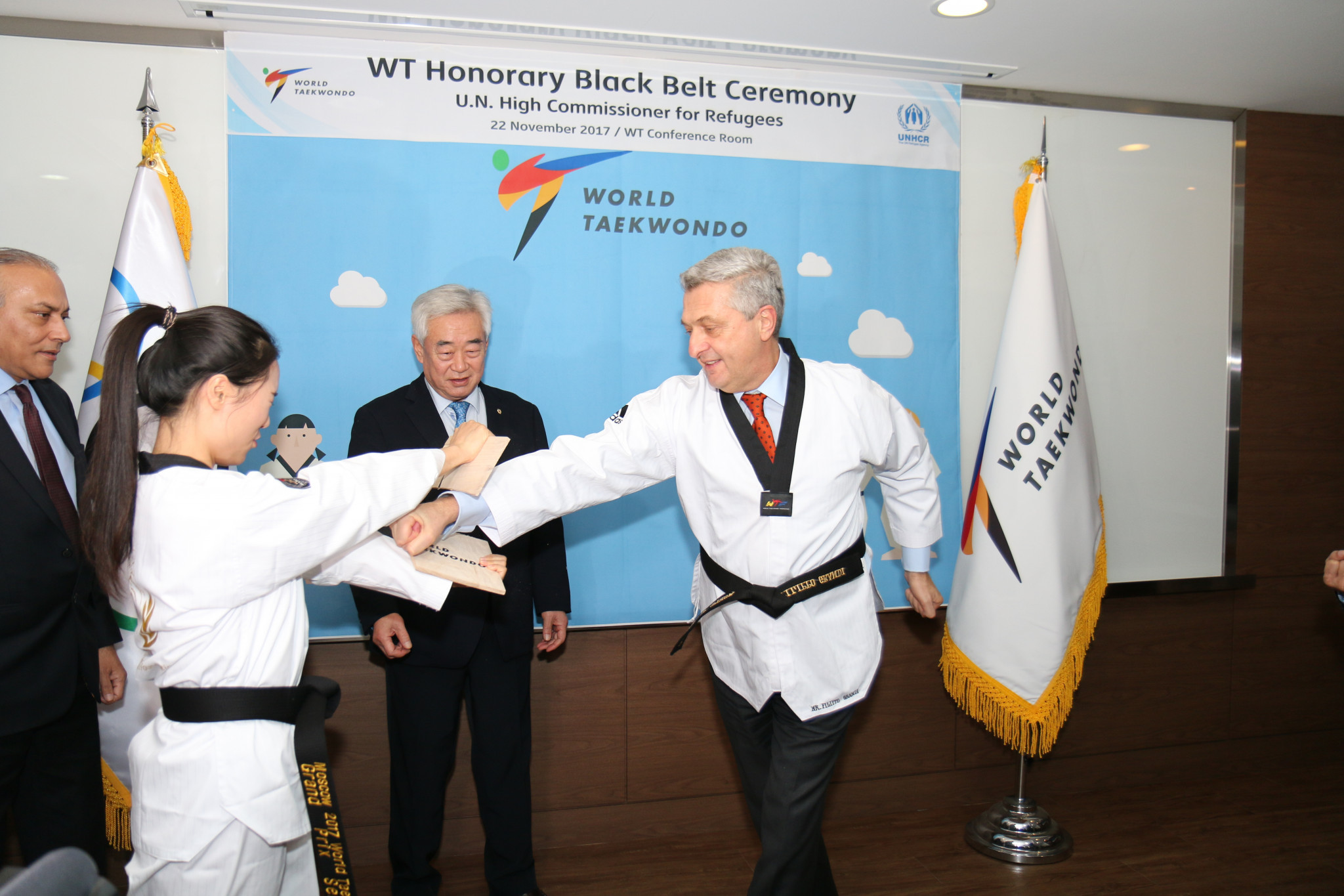 Filippo Grandi breaks a board after the black belt ceremony ©World Taekwondo