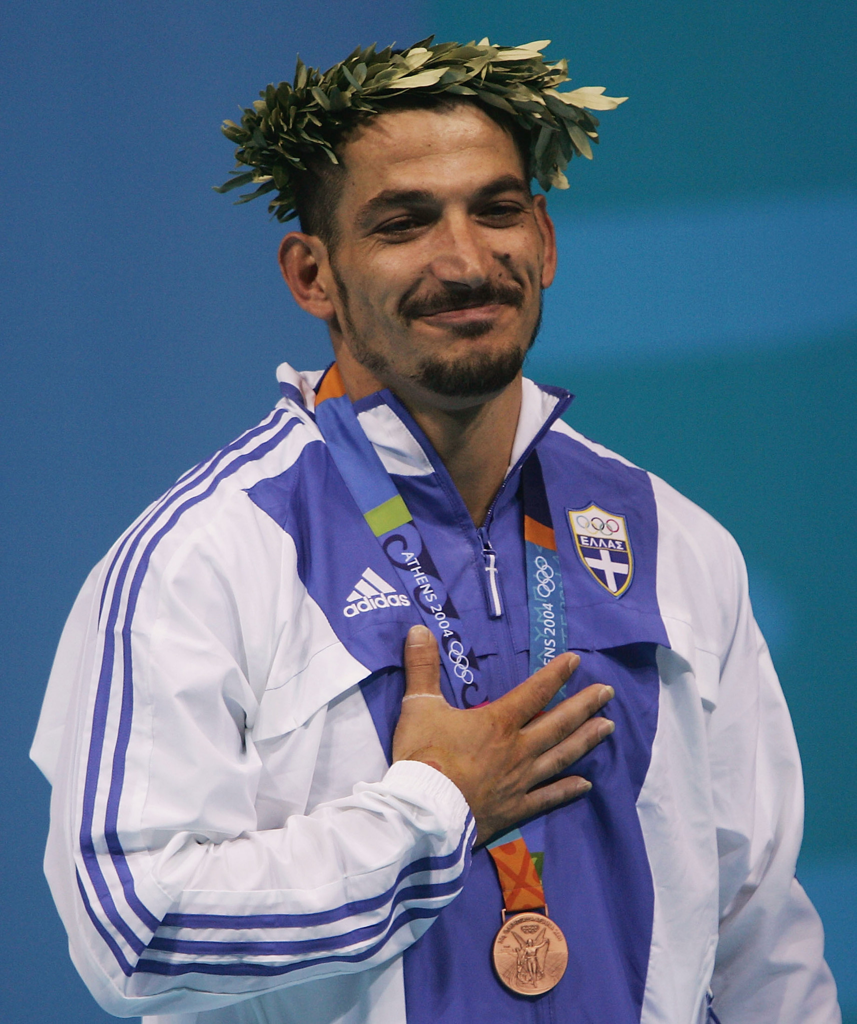 Pyrros Dimas, of Greece, seen here receiving the Olympic gold medal for the men's 85 kg category during Athens 2004, is now the technical director of USA Weightlifing ©Getty Images