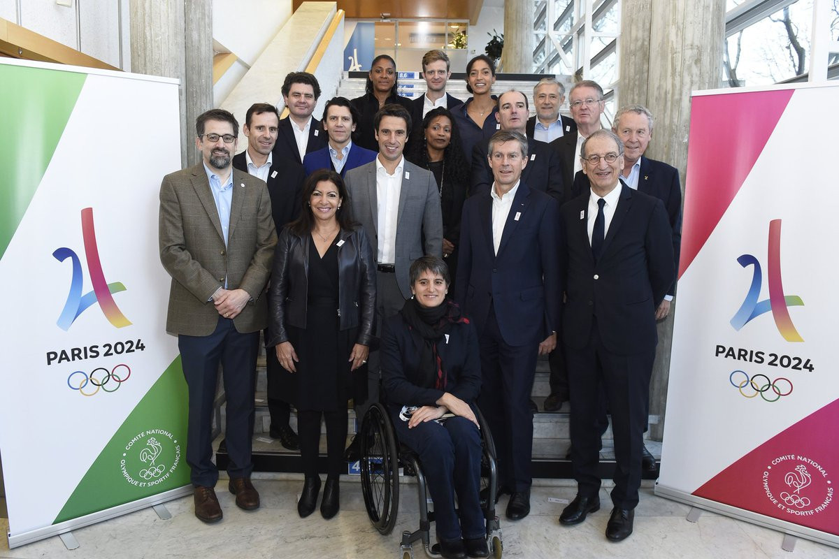 Paris 2024 and IOC figures pose during the IOC Orientation Seminar
