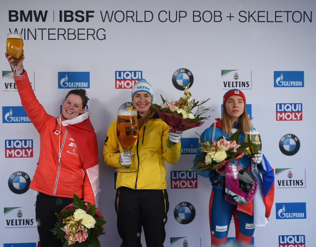 Elisabeth Vathje, of Canada, left, and Russia’s Elena Nikitina, right, joined Lölling on the podium ©IBSF/Viesturs Lacis