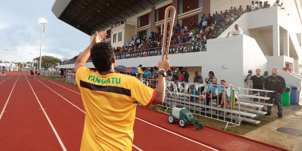 Queen's Baton Relay arrives during rugby sevens competition at Pacific Mini Games